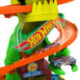 Hot Wheels City Conjunto de Juego T-Rex Batalla en Llamas con Coche Metálico Escala 1:64 y Dinosaurio Enemigo